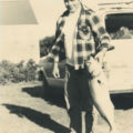 Charles E. Conrad holding his bluefish catch
